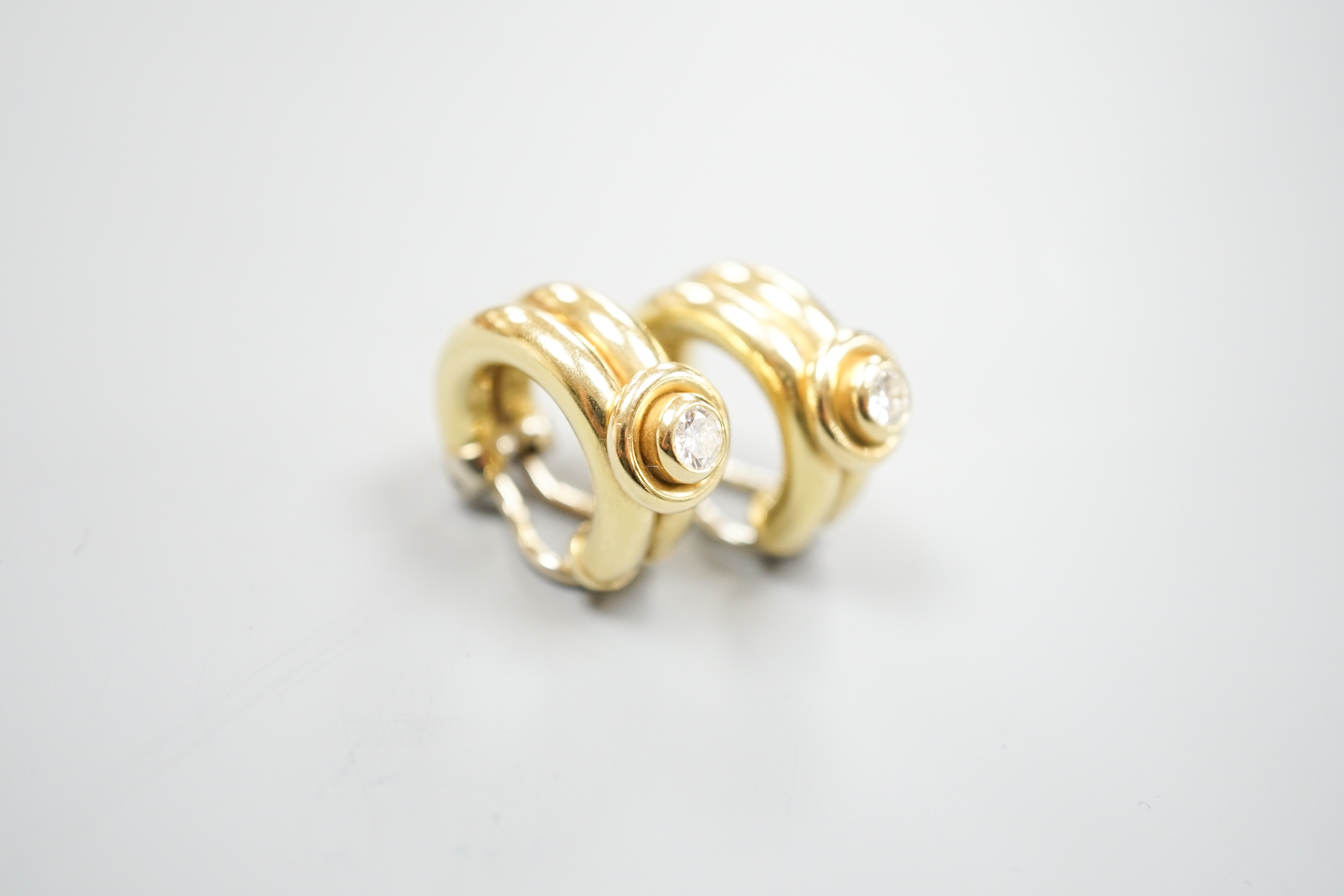 A pair of 20th century Italian 750 yellow metal and diamond set hoop ear clips, 22mm